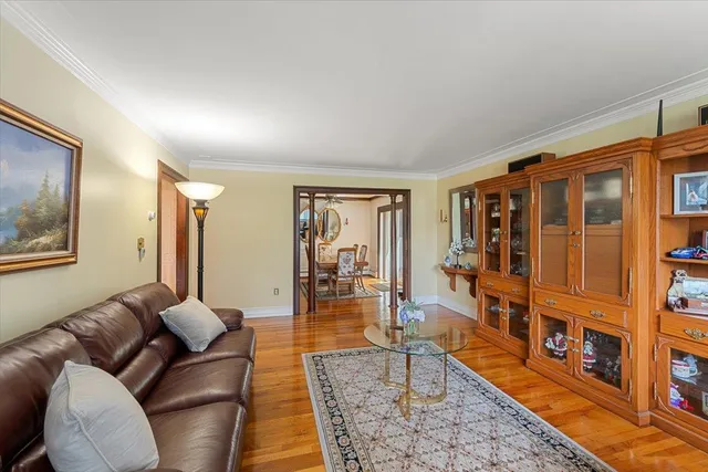 a living room with furniture and a table