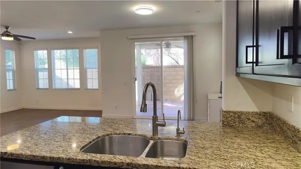 a kitchen with a sink and a window