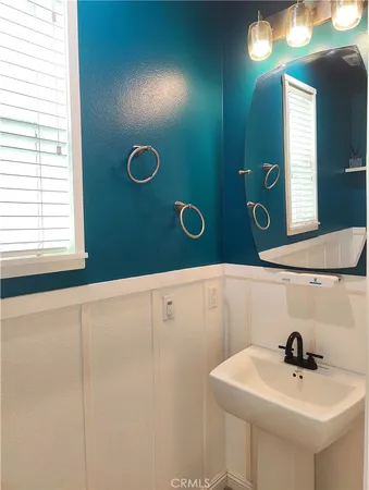 a bathroom with a sink and mirror