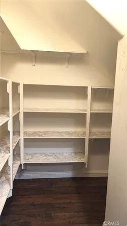 a close view of closet with wooden floor