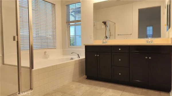 a bathroom with a shower and a sink