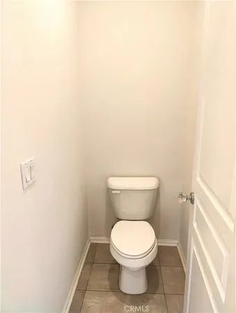a bathroom with a sink toilet and mirror