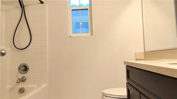 a swimming pool with outdoor seating and garden