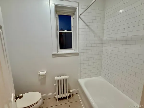 a bathroom with a bathtub and sink