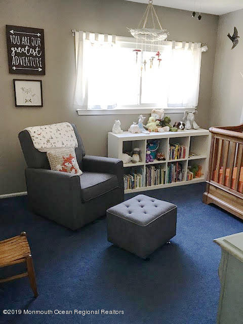 50 Sweet Gum Road Howell, NJ 07731 - Photo 12 of 18 a living room with furniture a window and a flat screen tv