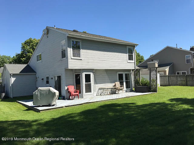 50 Sweet Gum Road Howell, NJ 07731 - Photo 15 of 18 a view of a house with backyard and porch