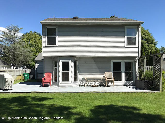 50 Sweet Gum Road Howell, NJ 07731 - Photo 16 of 18 a view of a house with swimming pool and a porch