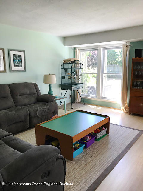 50 Sweet Gum Road Howell, NJ 07731 - Photo 7 of 18 a living room with furniture and a flat screen tv