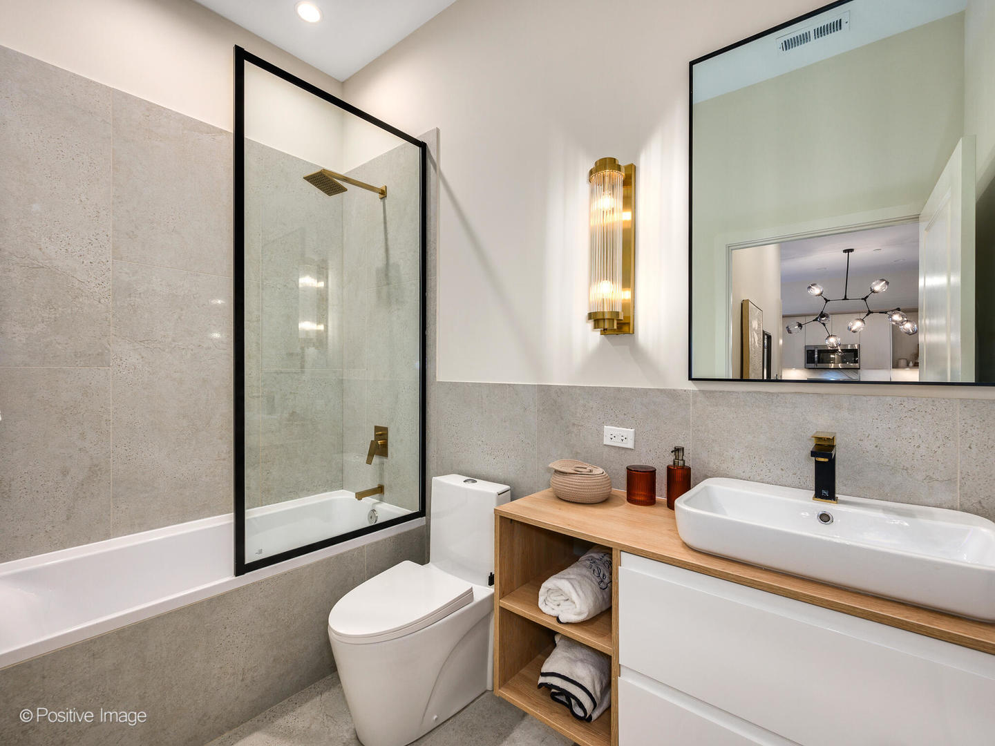 11 West Prospect Avenue, Unit 212 Mount Prospect, IL 60056 - Photo 12 of 34 a bathroom with a toilet sink and mirror