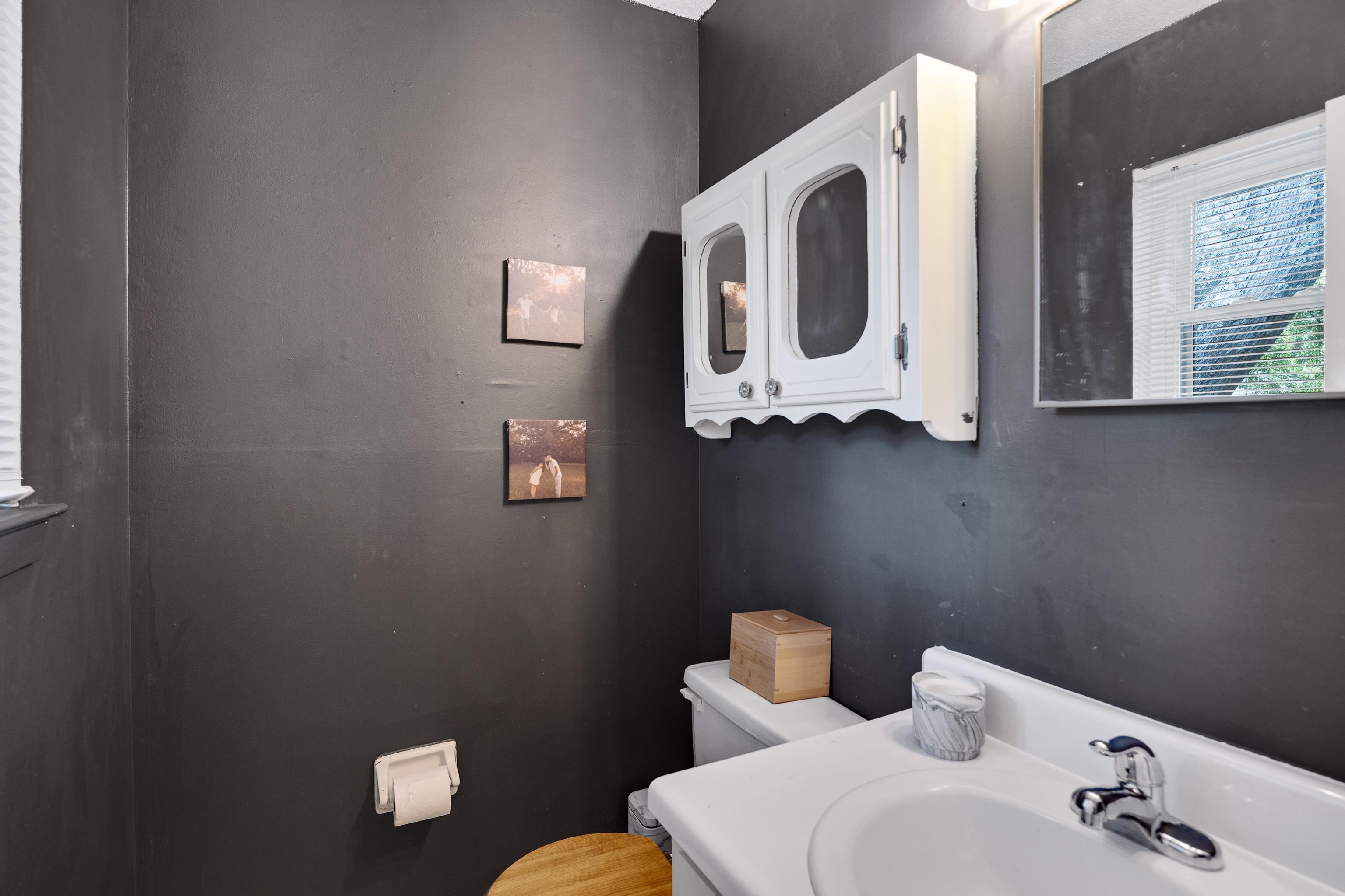 1137 Greenview Road Collierville, TN 38017 - Photo 25 of 35 a bathroom with a toilet sink and mirror