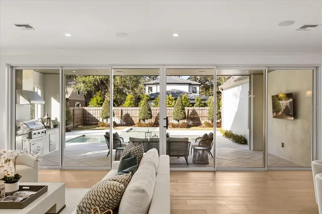 a living room with furniture and a white wall