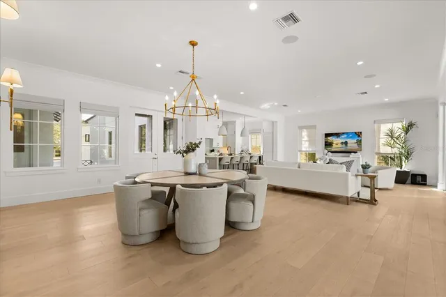 a utility room with cabinets washer and dryer