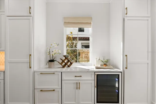 an empty room with windows and entrance