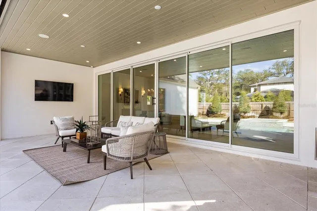 a view of a dining room with furniture and a window