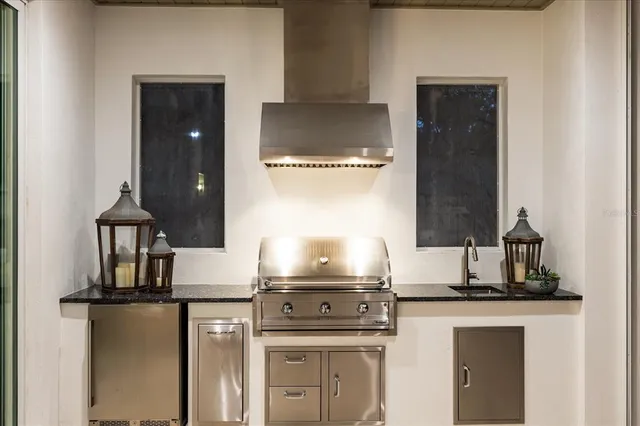 a view of a house with sitting area and garden