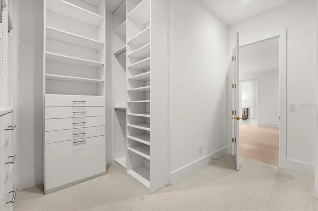 an aerial view of residential house with green space