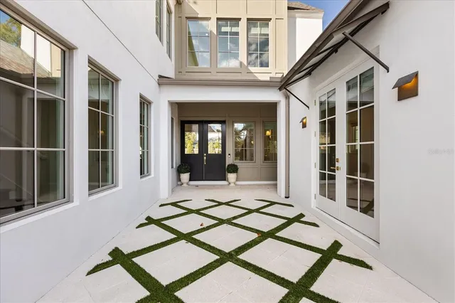 a kitchen with stainless steel appliances a sink a stove and cabinets