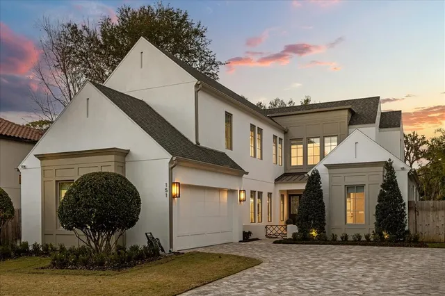 a open kitchen with white cabinets and white appliances