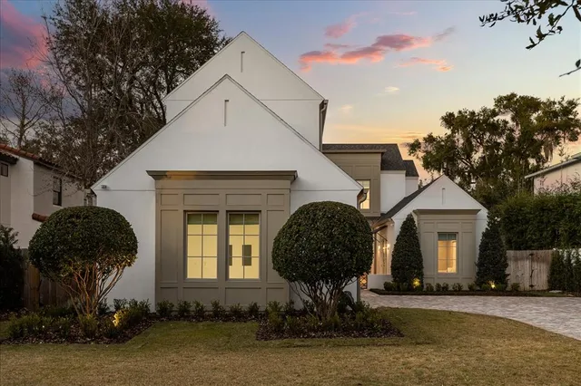 a view of a swimming pool with outdoor seating