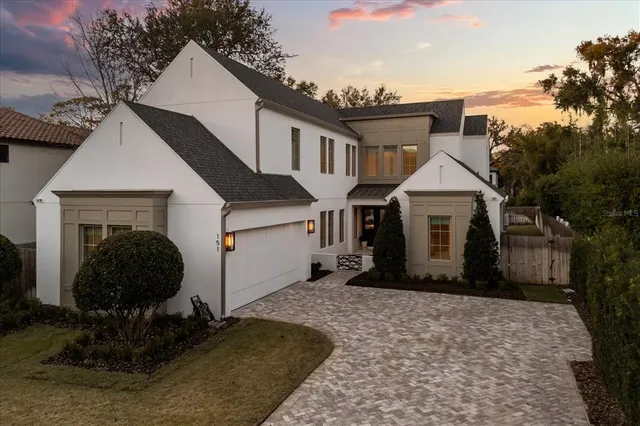 a view of a patio with dining table and chairs with a barbeque grill and couches