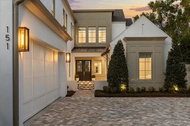 a living room with furniture a rug and a large window