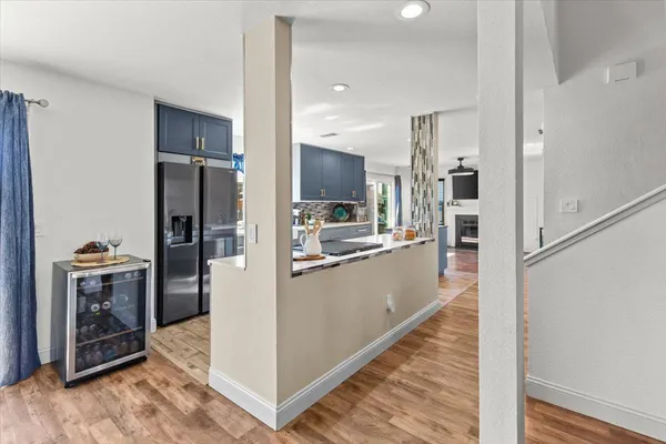 a kitchen with a refrigerator and a sink