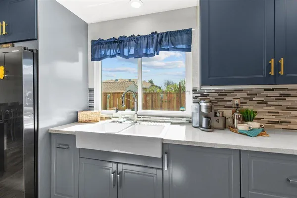a kitchen with a sink and cabinets