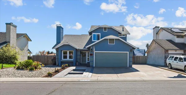 a front view of a house with garage