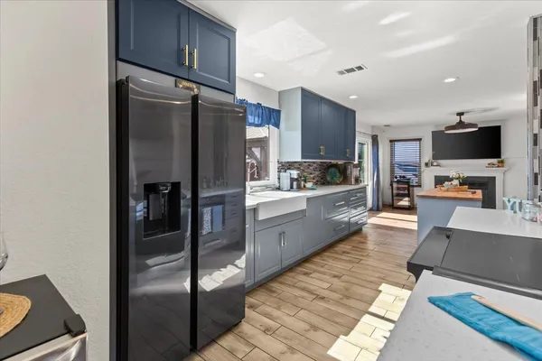 a kitchen with stainless steel appliances granite countertop a refrigerator stove and microwave