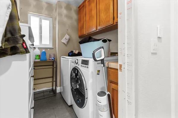 a bathroom with a sink mirror and toilet