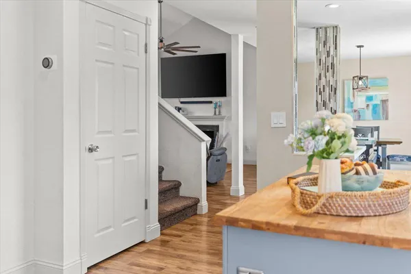 a living room with furniture and a ceiling fan