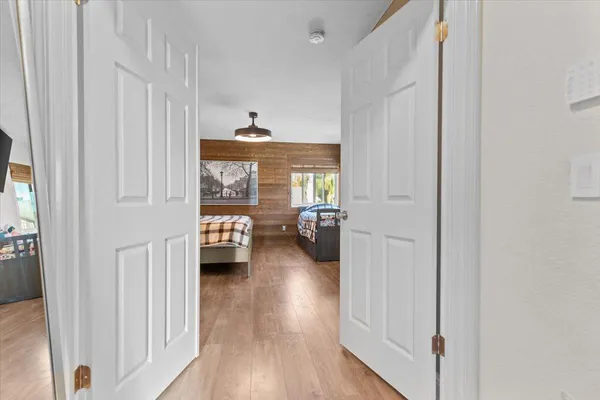 a bedroom with furniture and a window