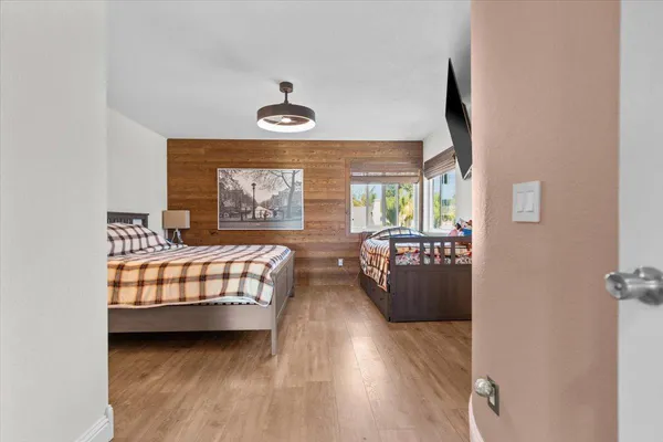 a bedroom with a bed and dresser