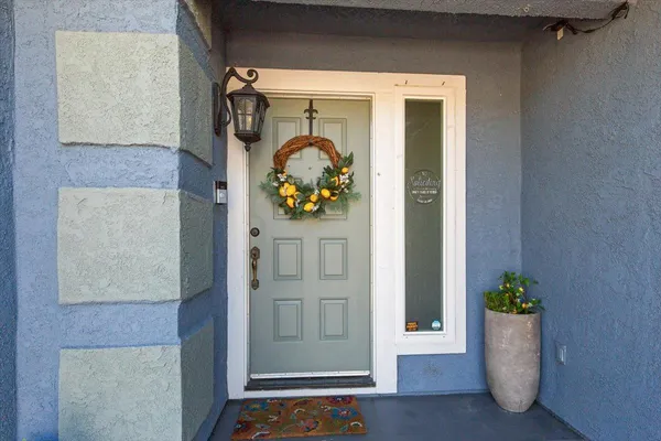 a front view of a house with garden