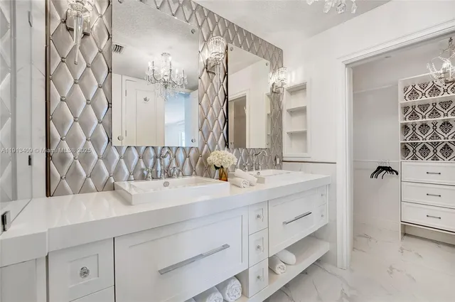 a bathroom with a double vanity sink mirror and