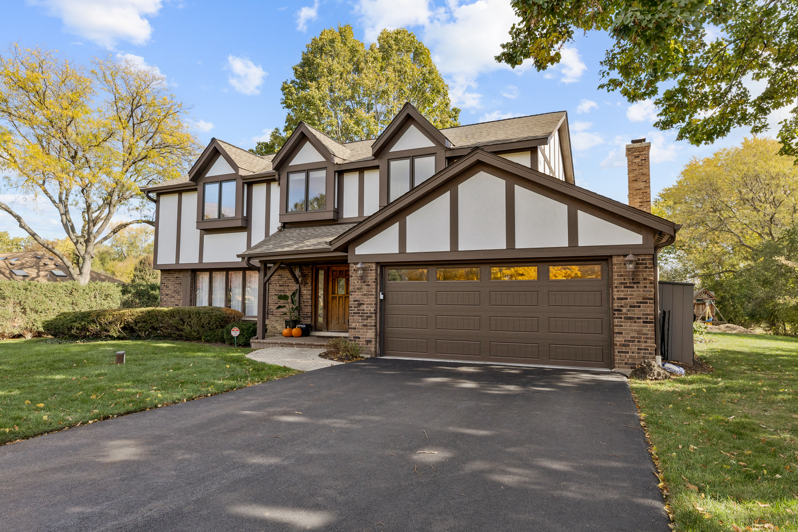 2544 Rfd Shenandoah Lane Long Grove, IL 60047 - Photo 2 of 10 a front view of a house with a yard and garage