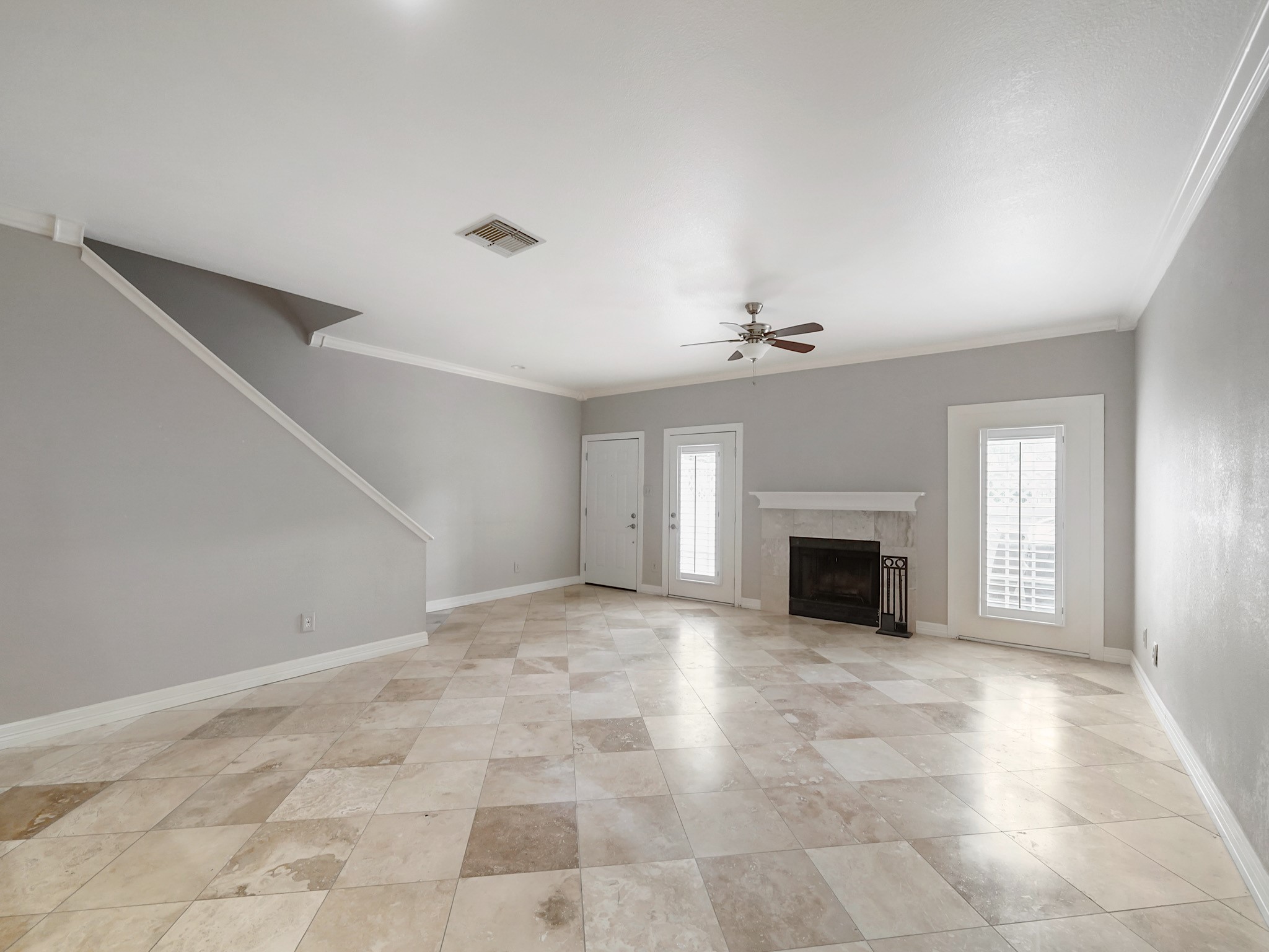 6000 Reims Road, Unit 2205 Houston, TX 77036 - Photo 7 of 35 Living space featuring a cozy fireplace.