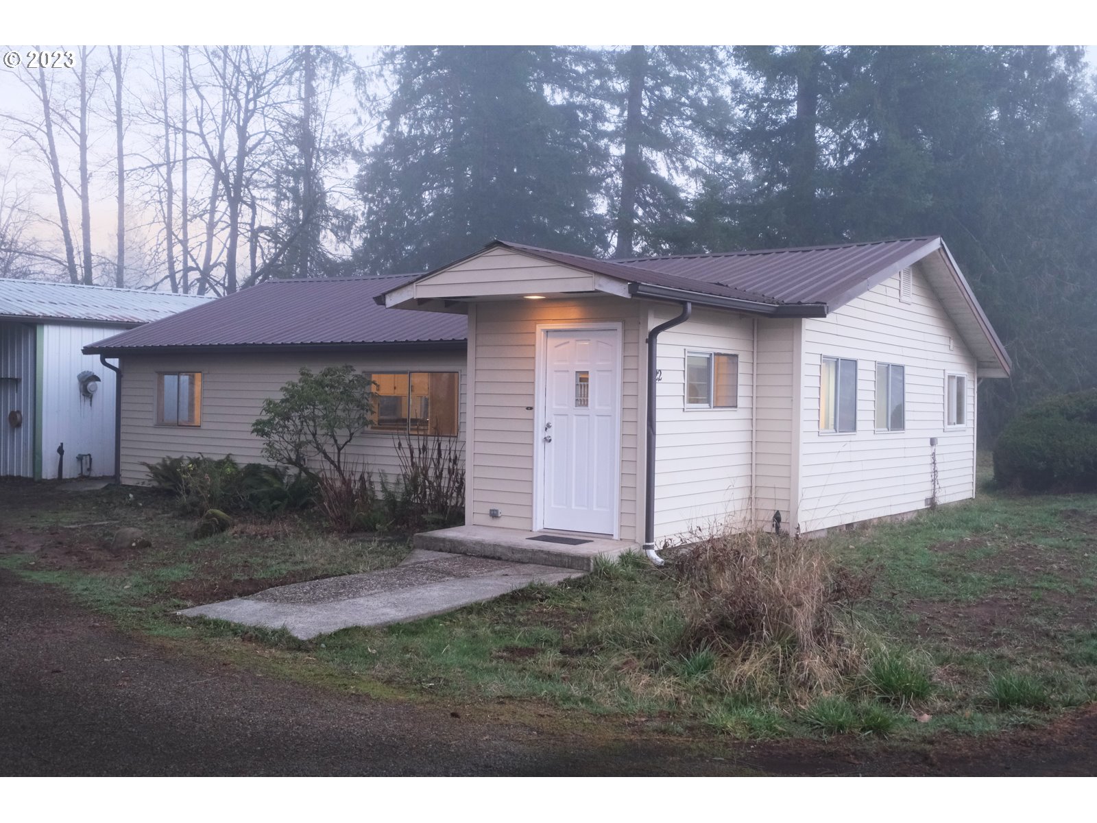 122 Talbott Road Salkum, WA 98582 - Photo 2 of 32 a front view of a house with a yard and garage
