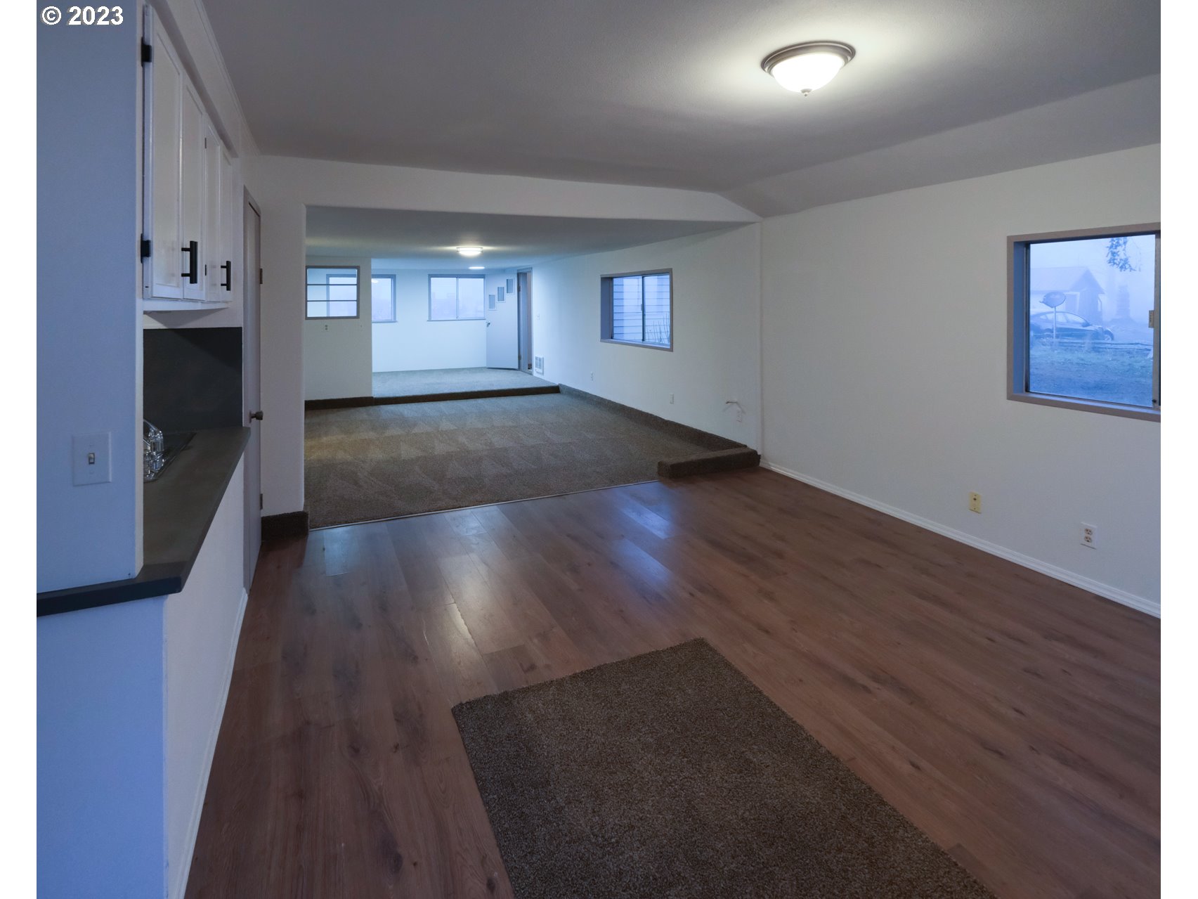 122 Talbott Road Salkum, WA 98582 - Photo 23 of 32 an empty room with wooden floor and windows