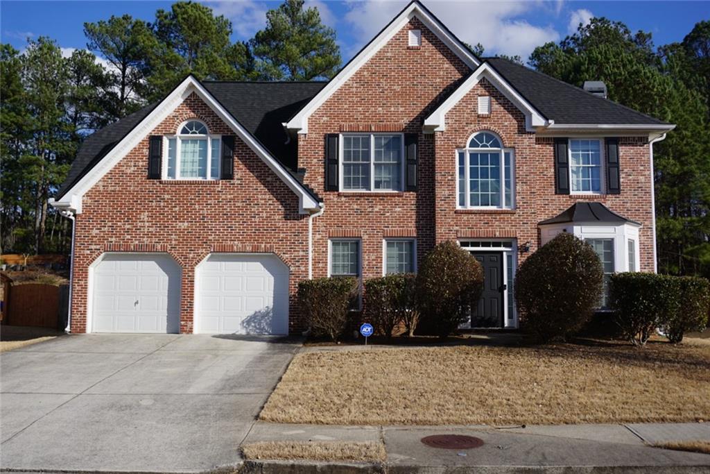 1356 Red Hill Road Marietta, GA 30008 - Photo 1 of 1 a front view of a house with garden