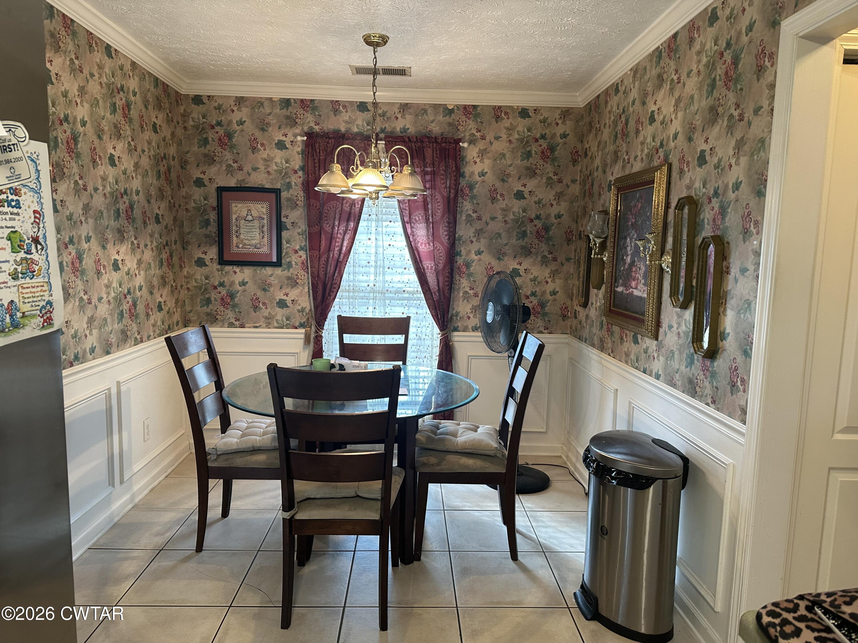204 Rooker Drive Jackson, TN 38305 - Photo 4 of 8 a view of a dining room with furniture and chandelier