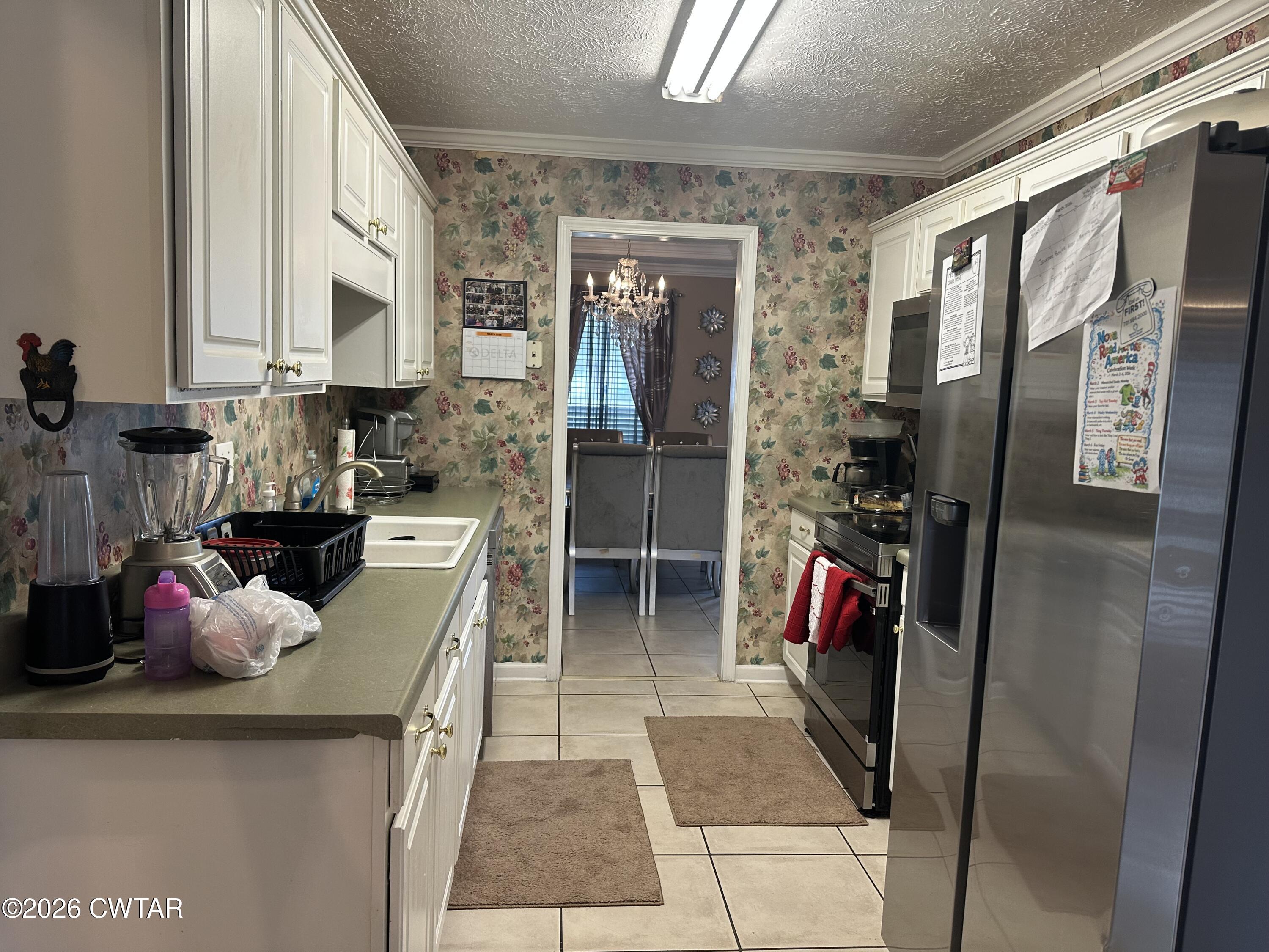 204 Rooker Drive Jackson, TN 38305 - Photo 5 of 8 a view of a refrigerator and storage