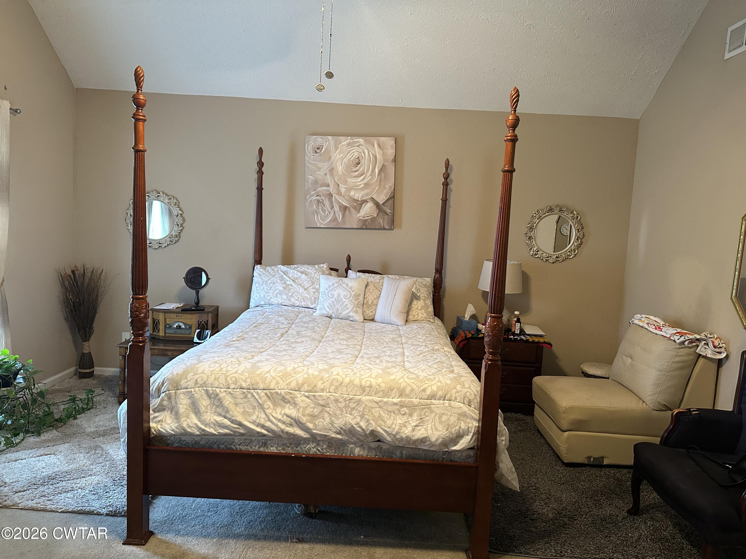 204 Rooker Drive Jackson, TN 38305 - Photo 6 of 8 a bedroom with a bed and chair