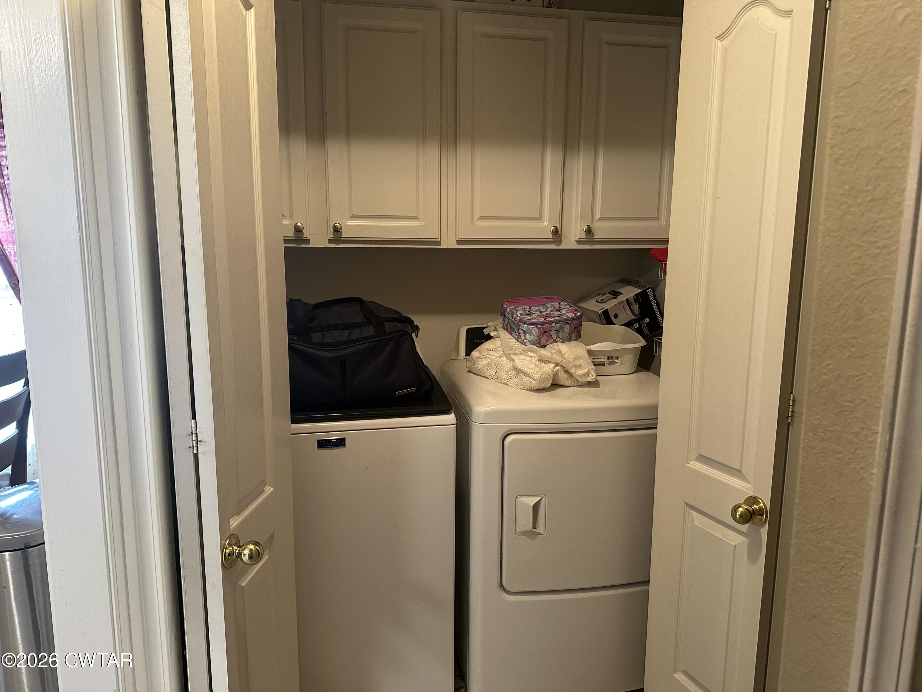 204 Rooker Drive Jackson, TN 38305 - Photo 8 of 8 a utility room with dryer and washer
