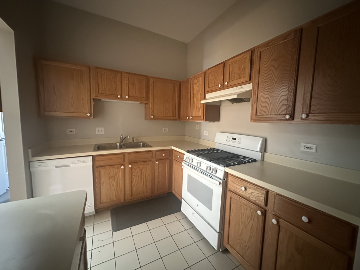 105 East 11th Street, Unit 2 Lockport, IL 60441 - Photo 7 of 14 a kitchen with a sink a stove and cabinets