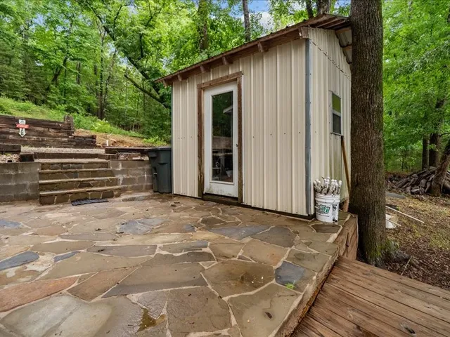 a backyard of a house with seating space