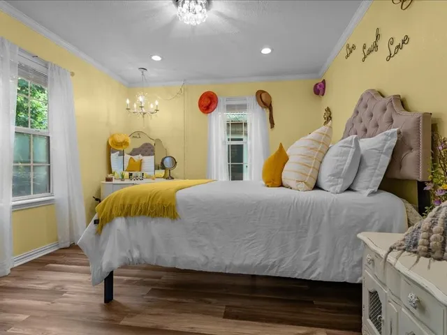 a bedroom with a bed and window