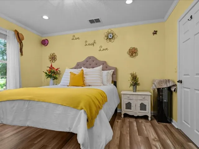 a bedroom with a bed and a mirror