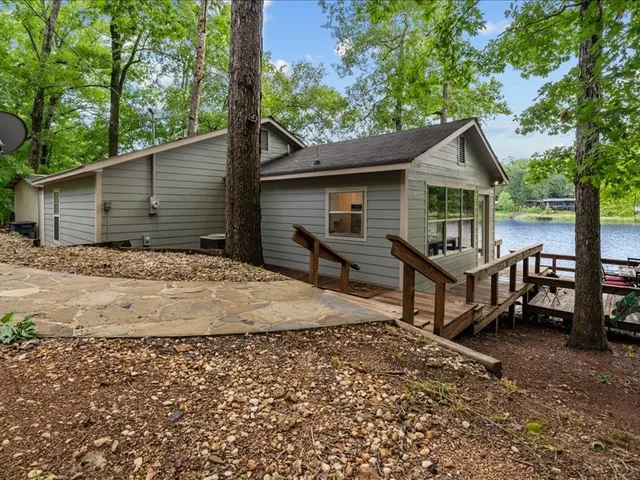 a house with trees in the background