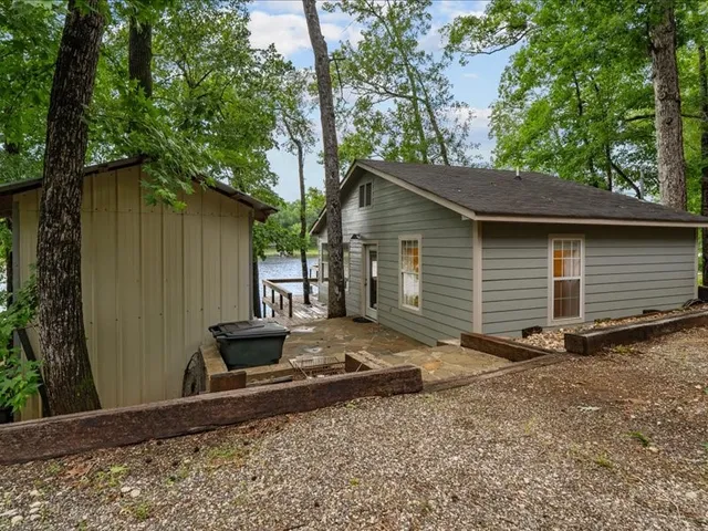 a backyard of a house with a tree
